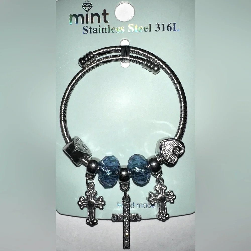Mint Stainlees Steal Charm Bracelet with Divinity Cross, Hearts and Beads.